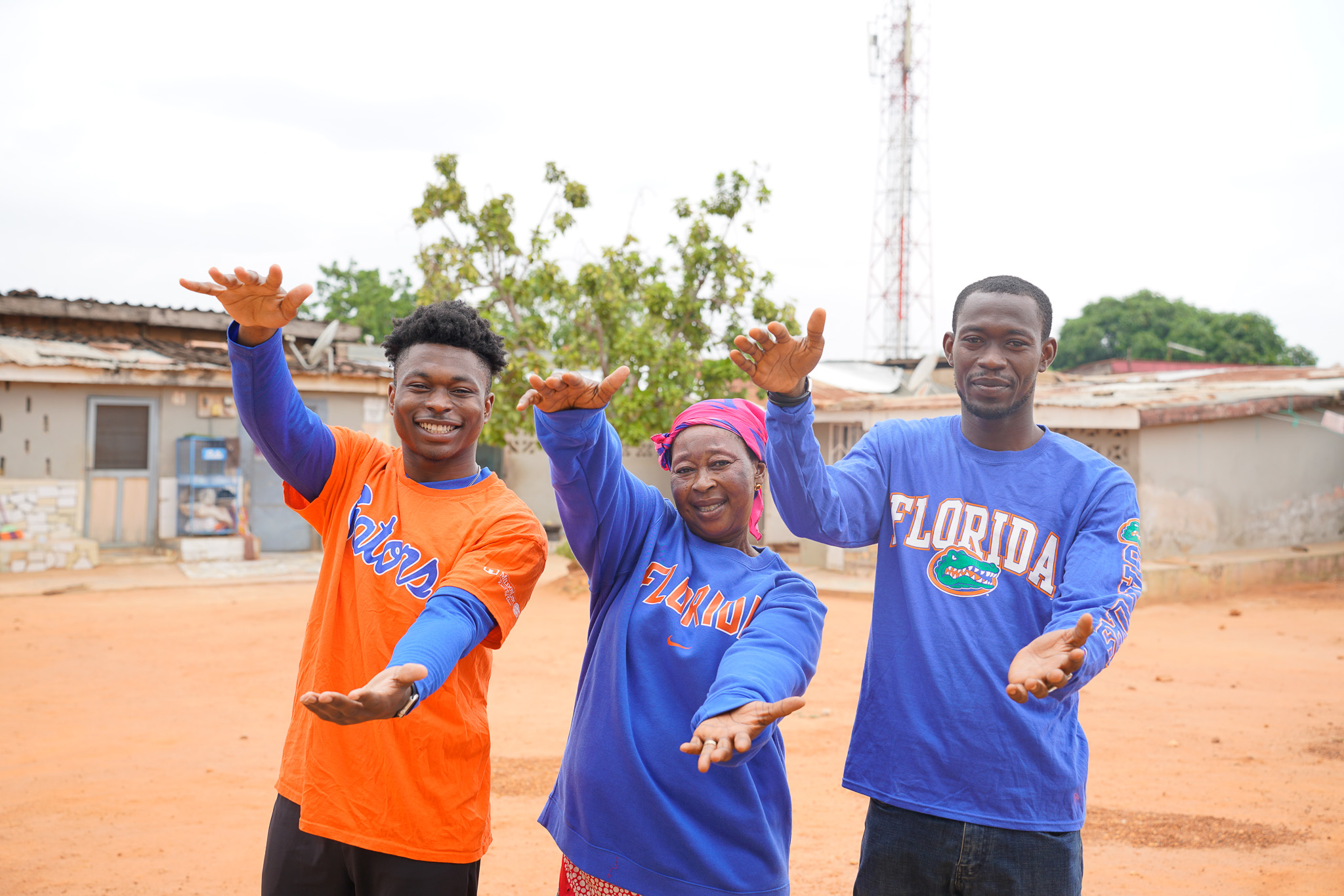 Melvin's family doing the Gator chomp in Ghana