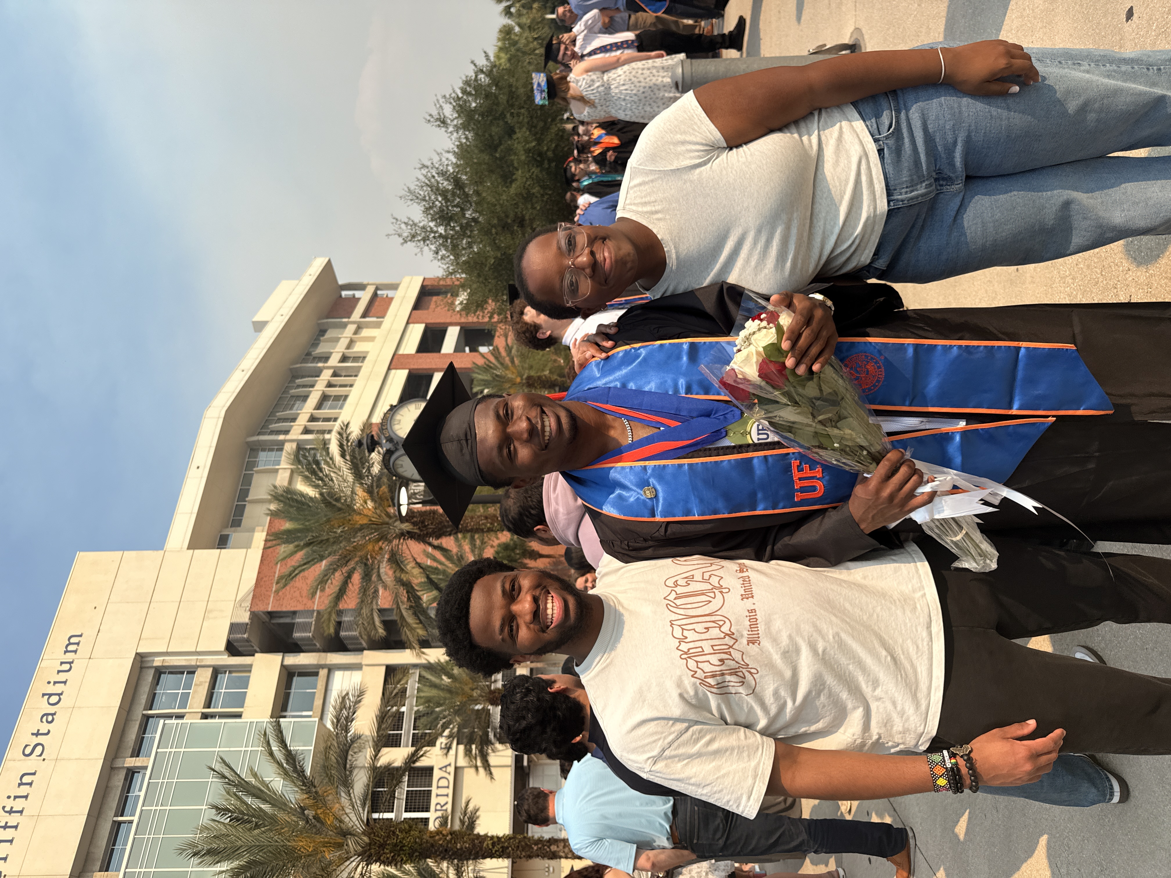 Melvin celebrating graduation with friends