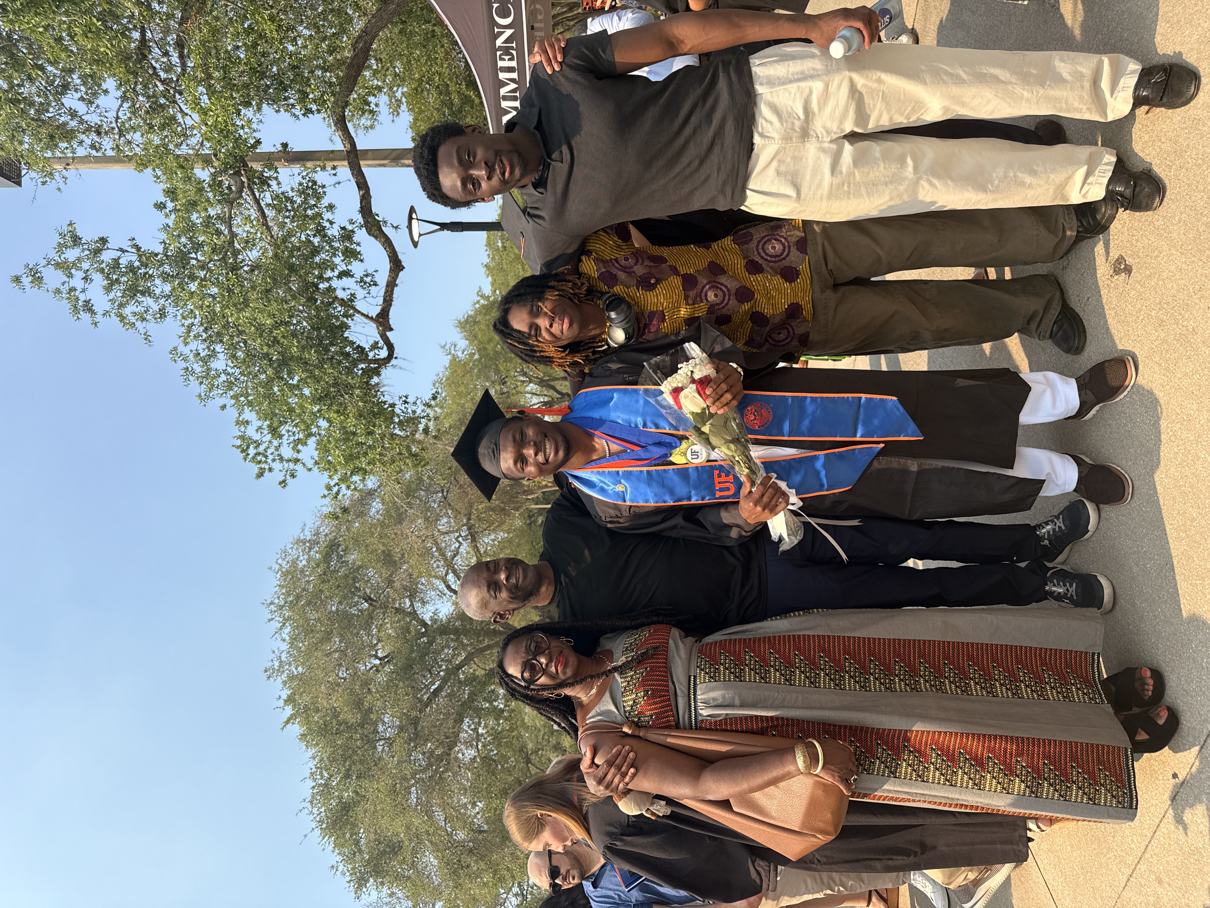 Melvin with host family at graduation